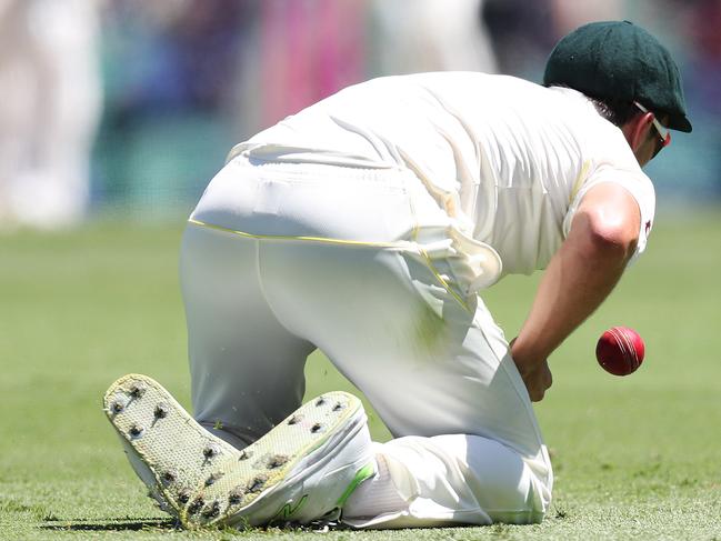 Australia's Pat Cummins drops England's Tom Curran off the bowling of Australia's Nathan Lyon during day 2 of the 5th Ashes Test between Australia and England at the SCG. Picture: Brett Costello