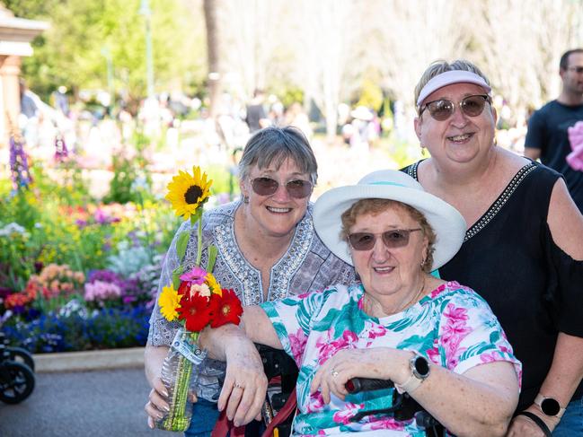 Yvonne Gisler (seated) with Jodie Brown (left) and Sharon Blakeley in the Botanic Gardens, Queens Park for the Carnival of Flowers, Sunday September 22, 2024. Picture: Bev Lacey