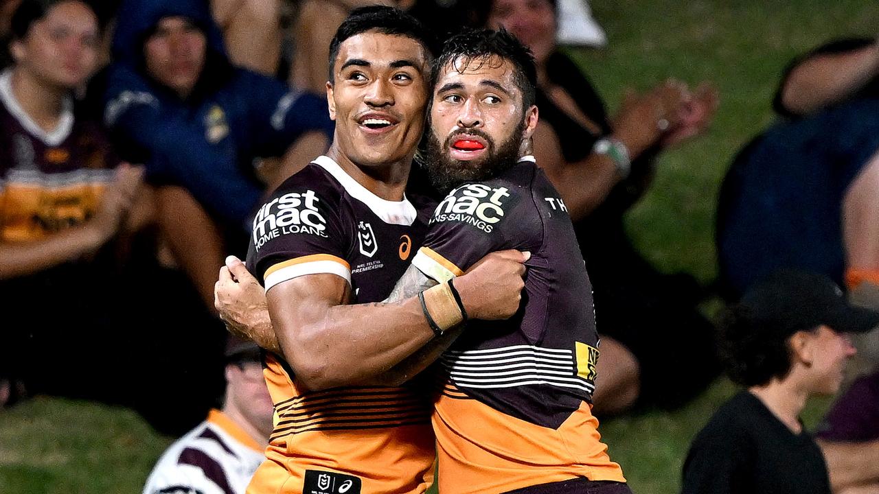 Jordan Pereira (right) of the Broncos celebrates a try. Picture: Bradley Kanaris/Getty Images