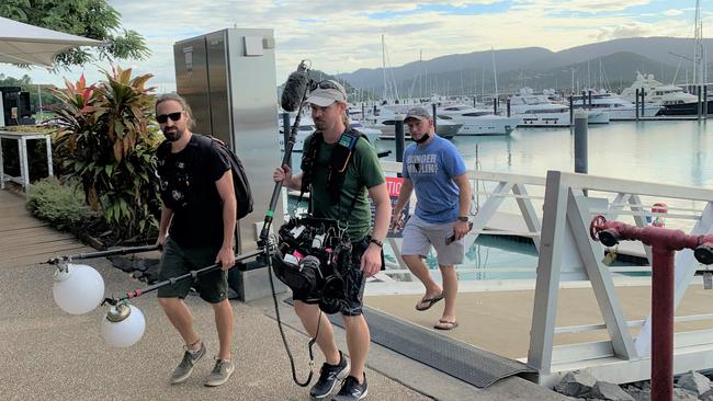 The film crew were tight-lipped about the goings on aboard the superyacht Thalassa at Coral Sea Marina on Tuesday, but witnesses said they appeared to be making a reality TV show.