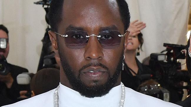 (FILES) Sean Combs (L) and singer Cassie Ventura arrives for the 2018 Met Gala on May 7, 2018, at the Metropolitan Museum of Art in New York. Superstar rapper and music industry mogul Sean Combs was sued November 16 by the singer Cassie, who accused him of rape and physical abuse. The hip-hop artist, known as both Puff Daddy or Diddy, subjected the R&B singer, whose real name is Casandra Ventura, to more than a decade of coercion by physical force and drugs as well as a 2018 rape, she said in her suit, filed in federal court in Manhattan. (Photo by ANGELA WEISS / AFP)