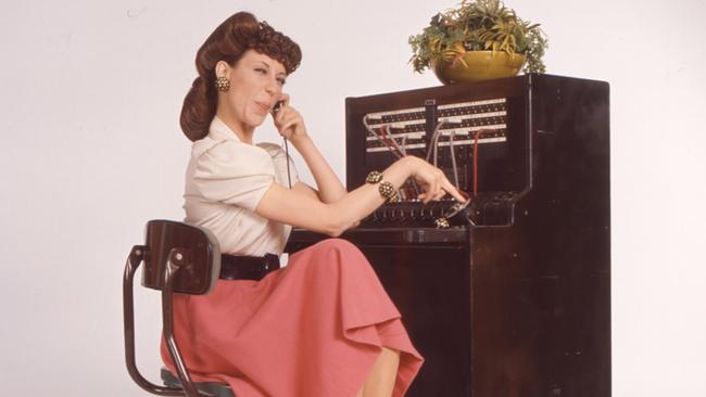 Zoom fatigue was inevitable given how unnatural conversational patterns can get there, says linguistic anthropology professor Susan Blum. Actor Lily Tomlin is pictured portraying a hard-edge phone operator named Ernestine in 1970s TV series Laugh In.