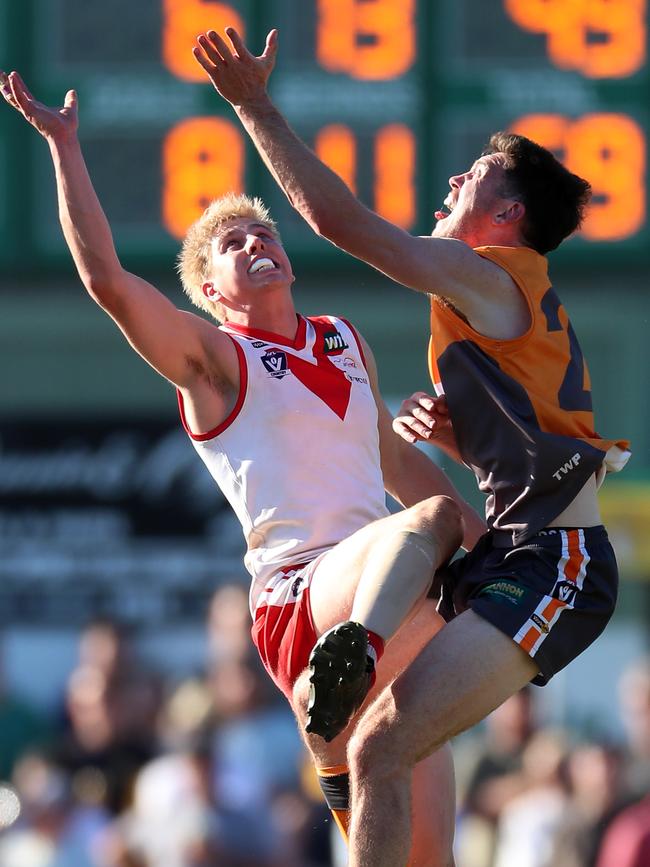 Southern Mallee Giants coach Kieran Delahunty, right, battles against Ararat’s Cody Lindsay in the Wimmera league grand final last month. Picture: Yuri Kouzmin