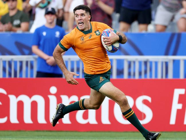 PARIS, FRANCE - SEPTEMBER 09: Ben Donaldson of Australia breaks forward to score his side's third try during the Rugby World Cup France 2023 match between Australia and Georgia at Stade de France on September 09, 2023 in Paris, France. (Photo by Warren Little/Getty Images)