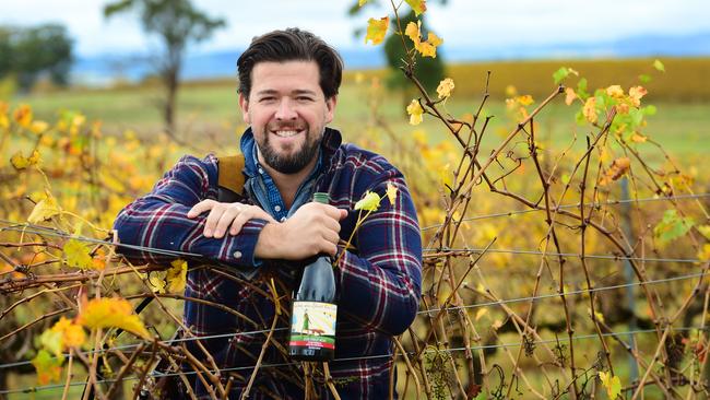 Fowles Wines chief executive Matt Fowles with a bottle of Ladies Who Shoot Their Lunch Shiraz at Avenel, Victoria. Picture: Zoe Phillips