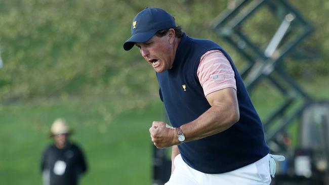 Phil Mickelson celebrates on the 18th green.