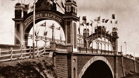 Flags adorned Princes Bridge in Melbourne for Prince Alfred’s 1867 visit. Picture: State Library Victoria