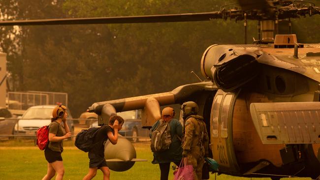 The ADF evacuate Omeo residents from the town’s football ground in January 2022.