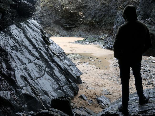 ONE TIME WEB USE ONLY - FEE APPLIES FOR REUSE -  The Crantock rock carving on Crantock Beach, Devon that reveal a beautiful secret at low tide.See SWNS story SWCAVE; Images reveal a hidden poem carved inside a Cornish cave which is only accessible at low tide. Crantock might only be a stone's throw from Newquay, Cornwall's liveliest resort, but its location between the two Pentire headlands ensures it remains a place of peace and tranquility. On the far side of the beach, an intriguing series of small caves hidden in the cliff walls hold a secret few could ever spot without knowing what to look for. Only at low tide can you see the mythical Crantock rock carving, which is the stuff of legend in the local area.  Picture: SWNS/Mega