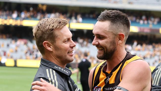 MELBOURNE.  20/03/2022.   AFL. Round 1.  Hawthorn vs North Melbourne at the MCG . .  Sam Mitchell, senior coach of Hawthorn. Hugs Jack Gunston after todays win . Photo by Michael Klein