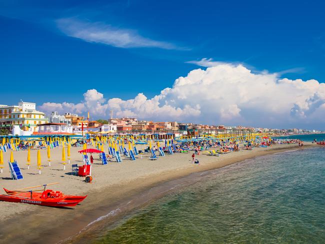 Lido Di Ostia, Italy - September 14, 2016: Swimming and relaxing people on the beautiful beach Lido di Ostia ( Lido di Roma), private beach Battistini, Italy.