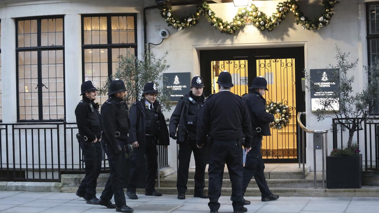 Police officers outside the main entrance of King Edward VII Hospital, where Prince Philip is being treated. Picture: Philip Toscano/PA via AP