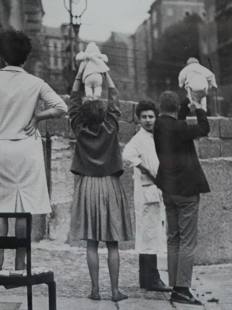 People hold their babies to show loved ones on the other side.