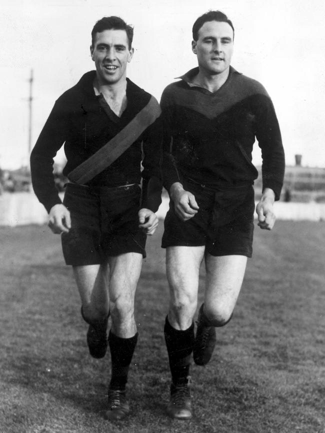 Harold Lambert and Greg Tate at Essendon training.