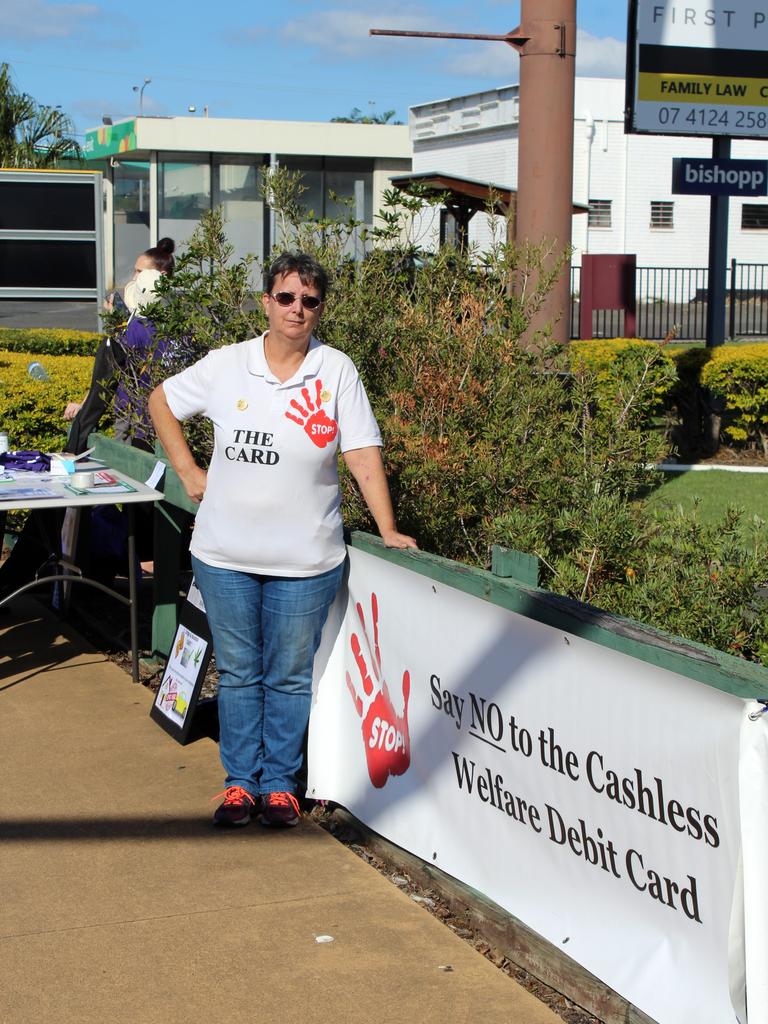 Cashless debit card critic Kathryn Wilkes protesting the scheme at Bundaberg and Hervey Bay to raise awareness before the federal election.