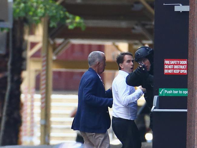 O’Brien and Stefan Balafoutis were met by police and led to safety. Picture: Don Arnold/Getty Images