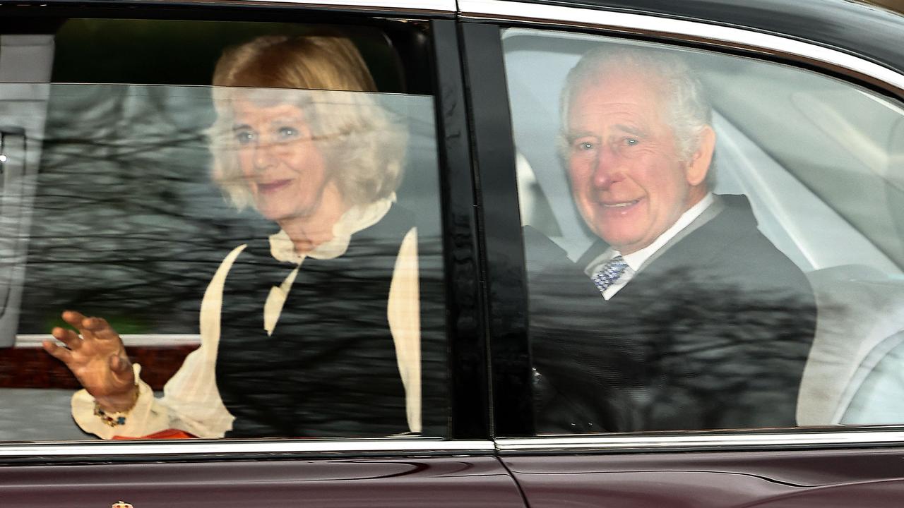 King Charles and Queen Camilla wave as they leave by car from Clarence House in London. Picture: Henry Nicholls/AFP