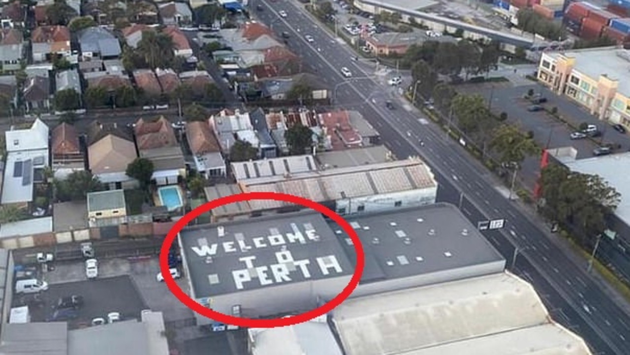 The sign on the roof of a nearby business flying into Sydney Airport caught a few passengers off-guard.