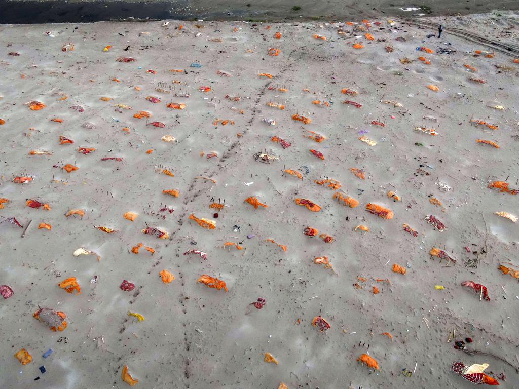 Bodies exposed in shallow sand graves on the banks of the Ganges River in Shringverpur, northwest of Allahabad, Uttar Pradesh, India. Picture: Getty Images