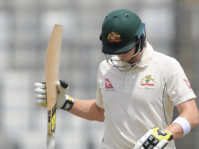 Australia's cricket team captain Steve Smith walks back to the pavilion after his dismissal by Bangladesh's Sakib Al Hasan during the fourth day of their first test cricket match in Dhaka, Bangladesh, Wednesday, Aug. 30, 2017. (AP Photo/A.M. Ahad)