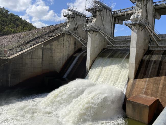 Water being released from Ross River Dam’s second spillway gate during testing on Thursday. Picture: Leighton Smith.