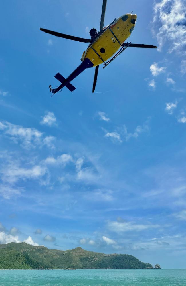 The RACQ CQ Rescue helicopter uses its winch at Cape Hillsborough. Picture: RACQ CQ Rescue