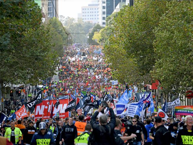 Union workers protest for better pay and more secure jobs in Melbourne, Wednesday, May 9, 2018. Thousands of workers have blocked off part of Melbourne's CBD, saying Prime Minister Malcolm Turnbull can keep the federal coalition's slated tax cuts for low- and middle-income workers. The rally on Wednesday is part of a nationwide campaign demanding better work conditions and pay. (AAP Image/Joe Castro) NO ARCHIVING