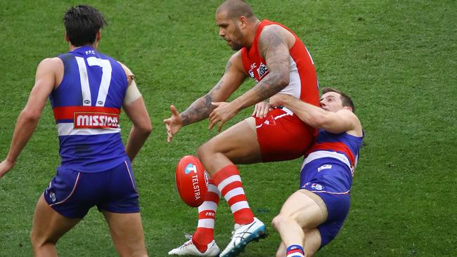 The Dale Morris tackle on Lance Franklin in the last minutes of the 2016 AFL Grand Final led to a matchwinning goal from Tom Boyd. Picture: George Salpigtidis