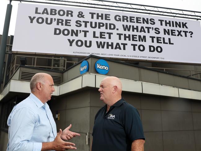 Michael Best, left, and Steve Old in front of an election billboard at the Brooker Inn last year. Picture: LUKE BOWDEN