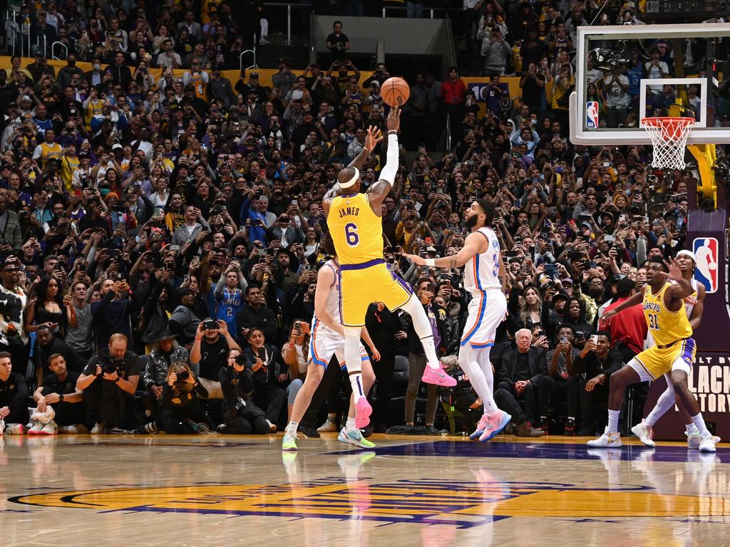 LeBron James shoots the ball to break Kareem Abdul-Jabbar's all time scoring record as Phil Knight watches on. Pic: Getty