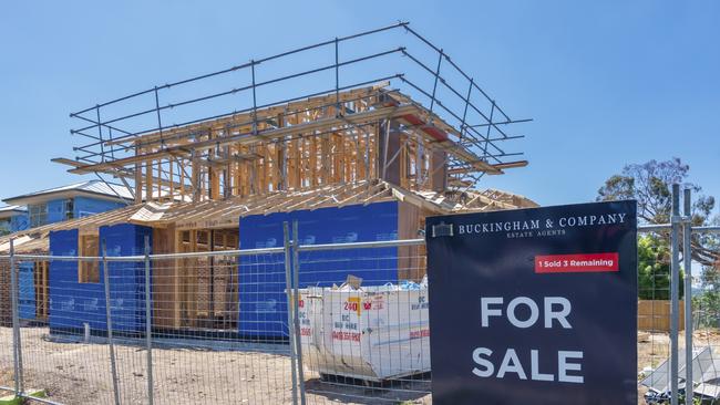 New houses under construction for sale in a suburb in Melbourne.