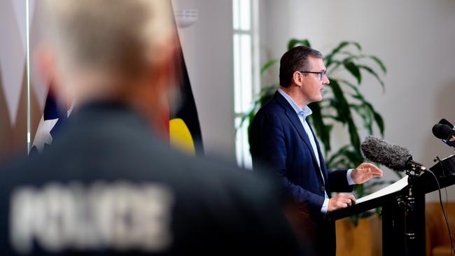 Chief Minister Michael Gunner, alongside CHO Dr Hugh Heggie and Police Commissioner Jamie Chalker give the gathered press an update on the Covid-19 situation in the Northern Territory including declaring that Alice Springs undergo a 72 hour lockdown. Picture: Che Chorley