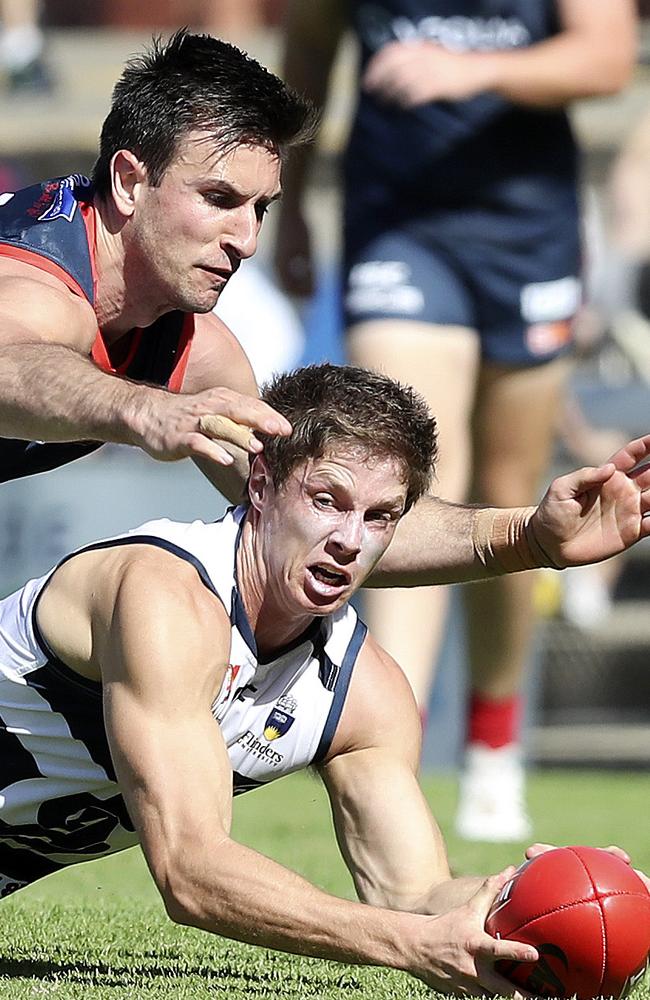 South Adelaide’s. Matthew Rose grabs possession from the bottom of a pack. Picture SARAH REED