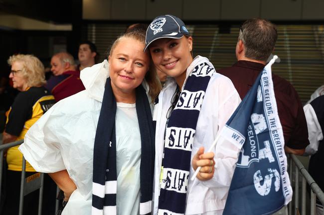 BRISBANE, AUSTRALIA - OCTOBER 24: Cats fans pose before the 2020 AFL Grand Final match between the Richmond Tigers and the Geelong Cats at The Gabba on October 24, 2020 in Brisbane, Australia. (Photo by Chris Hyde/AFL Photos/via Getty Images)