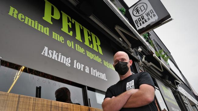 THANKS PETER: Bar Wa Izakaya co-owner Richard Hensens is temporarily closing up shop due to the surge in Covid cases. Picture: Kenji Sato.