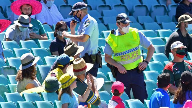 Policemen stand guard among sections of the crowd as the match was halted on Sunday. Picture: Saeed Khan/AFP