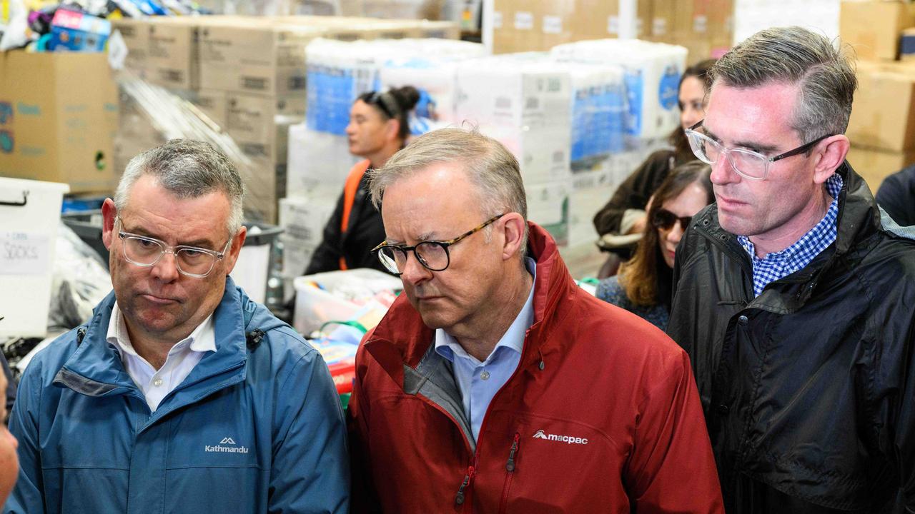 Federal Minister for Emergency Management Murray Watt, Prime Minister Anthony Albanese and NSW Premier Dominic Perrottet meeting volunteers and flood victims in the Hawkesbury. Picture: NCA NewsWire / James Gourley