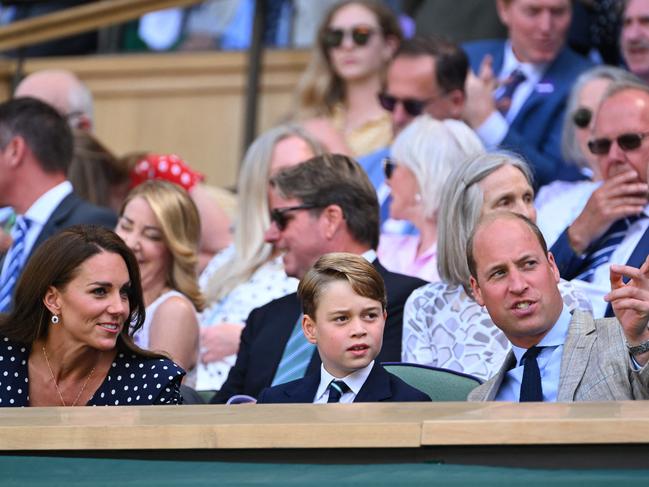 The Cambridges take their seats for the men's singles final tennis match at Wimbledon. Picture: AFP