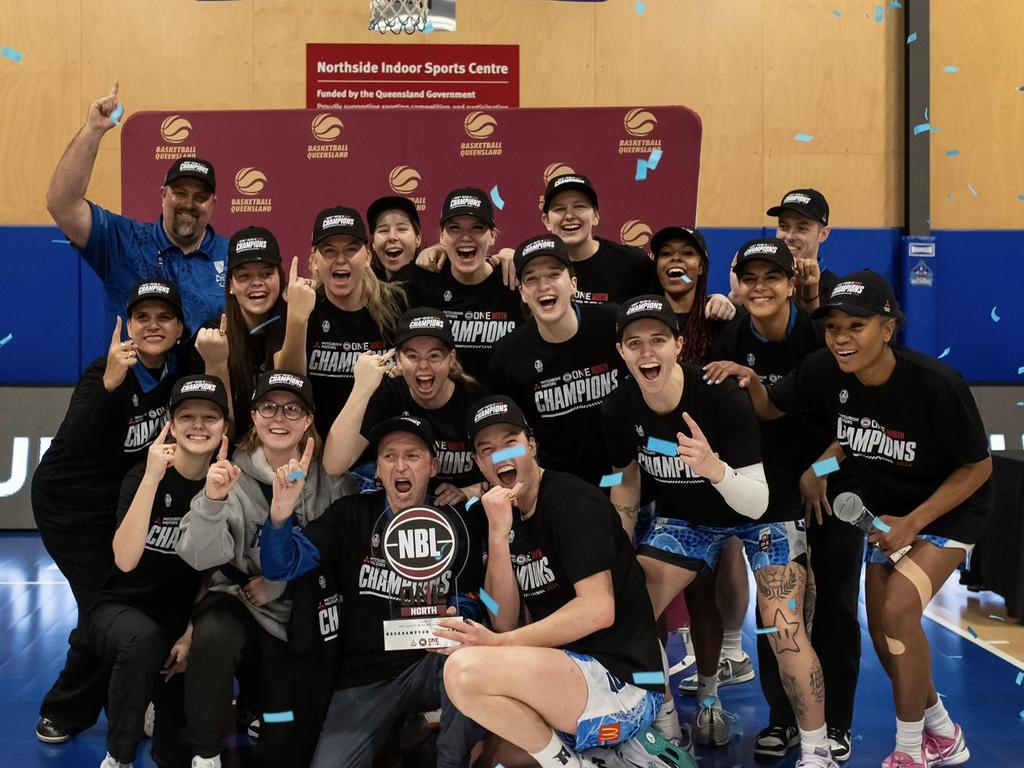 The Rockhampton Cyclones celebrate after taking out the NBL1 North championship last year.