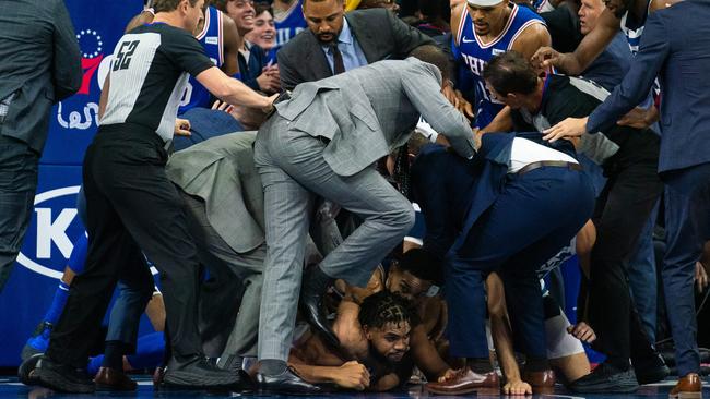 Ben Simmons holds Karl-Anthony Towns around the neck underneath a scrum of players and officials during the brawl between Philadelphia and Minnesota. Picture: Bill Streicher-USA TODAY Sports/Sipa USA