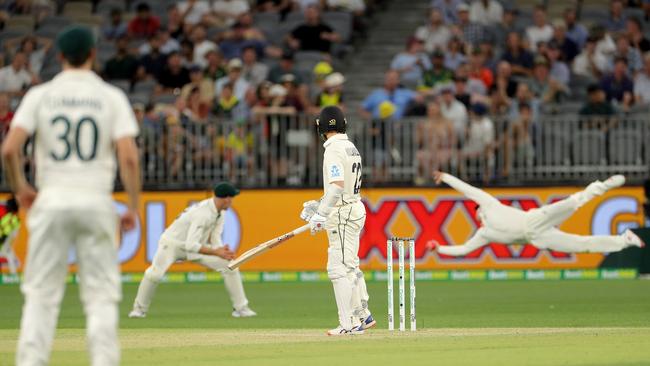 New Zealand captain Kane Williamson is dismissed by a spectacular catch from Steve Smith during day two of the first Test in Perth on Friday night. Picture: AAP