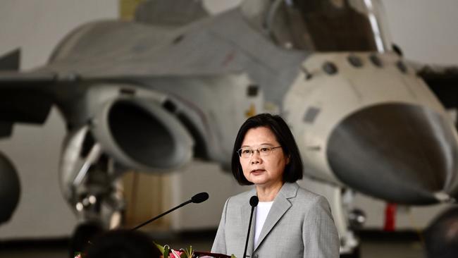 Taiwan's President Tsai Ing-wen speaks in front of a domestically-produced F-CK-1 indigenous defence fighter jet (IDF) during her visit to Penghu Air Force Base. Picture: AFP