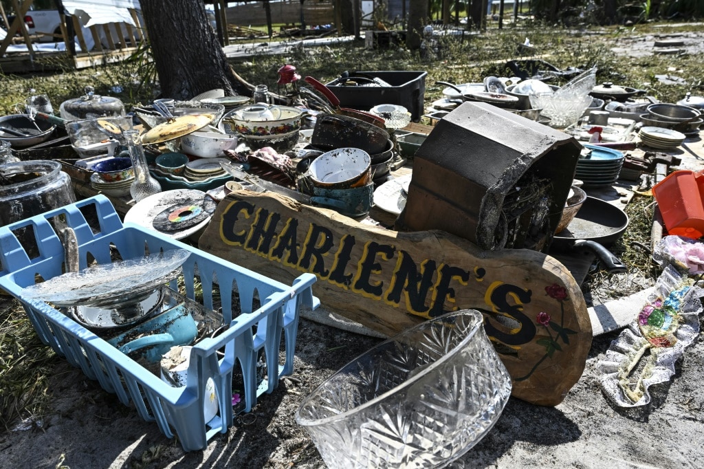 Remnants of Charlene Huggins's damaged house are scattered on the ground after Hurricane Helene struck Horseshoe Beach, Florida