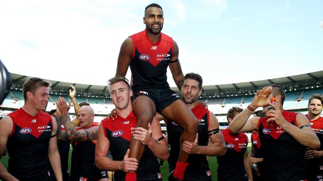 Heritier Lumumba is chaired off after his 200th game. Picture: Colleen Petch