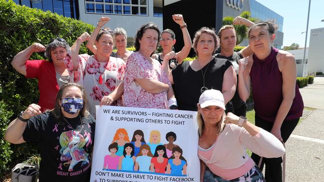 Spokesman Nicole Drummond (centre) and members of the Womens Cancer Support GC protesting at their treatment by social media giant Facebook. Picture: Glenn Hampson