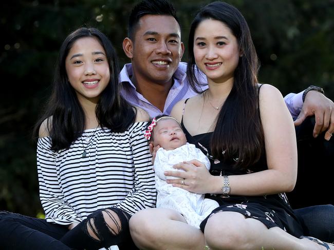 Blacktown family: Leanne Leach and partner Keith Mateo with daughters Kyla, 12, and Karissa 5 weeks worry about the impact on their lives in the future. Picture: Toby Zerna