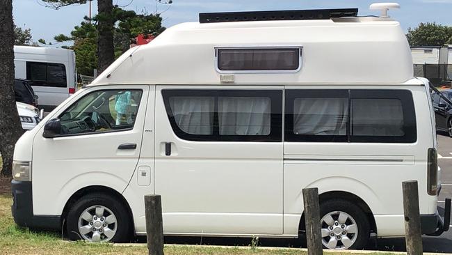 A campervan, wit the curtains deawn, parked in the car park at Dee Why Beach. Picture: Jim O'Rourke