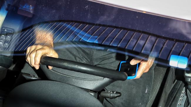 About 90 motorists a day are caught using their phones while on the road. Picture: Mark Stewart