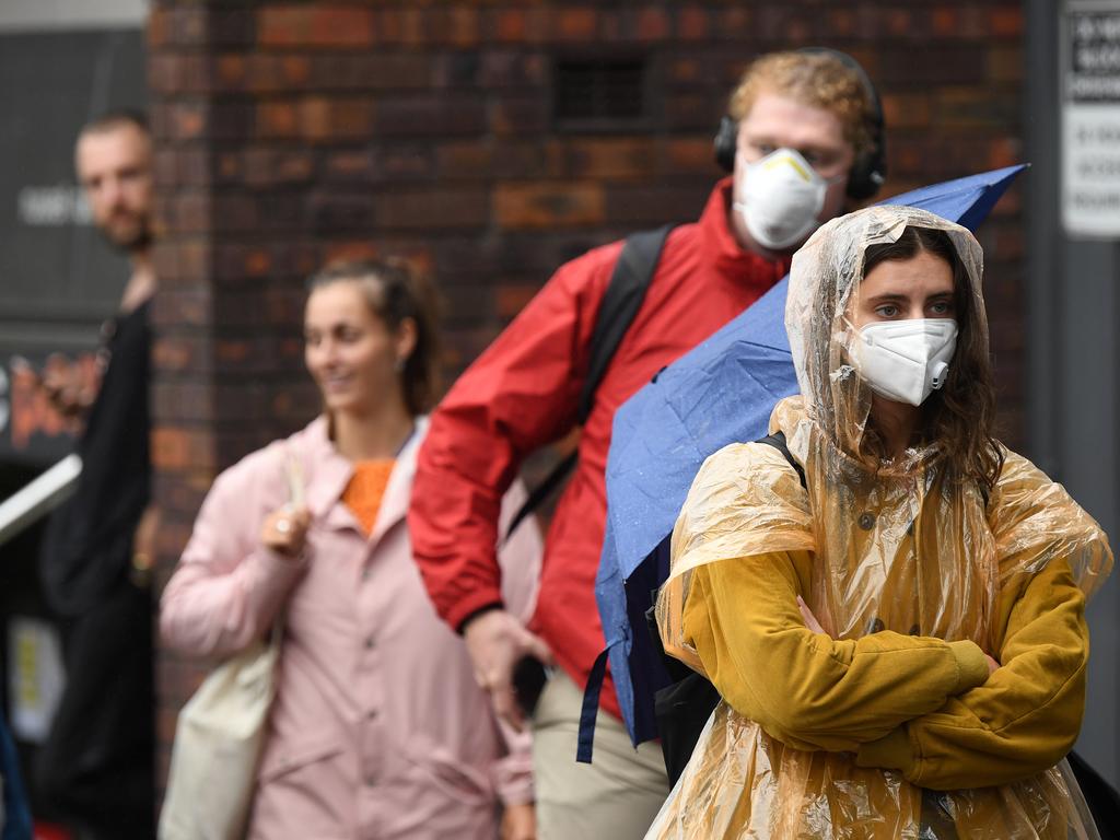Masks are essential for people who are suspected or confirmed of having COVID-19, or looking after someone who is unwell, experts say. Picture: Joel Carrett/AAP