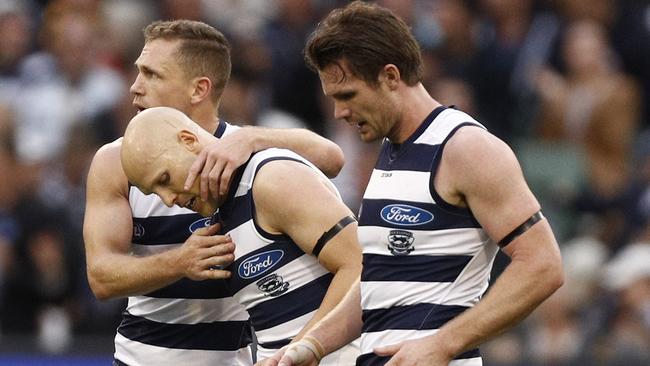 Gary Ablett with Joel Selwood and Patrick Dangerfield after kicking a goal. Picture: AAP